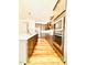 Modern kitchen with stainless steel appliances, sleek cabinets, and hardwood floors at 1950 Menet St, Apex, NC 27502