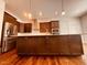 Contemporary kitchen with stainless steel appliances, center island, and lots of cabinets at 1950 Menet St, Apex, NC 27502