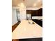Close-up of a kitchen island with a stainless steel sink, faucet, and quartz countertops at 1950 Menet St, Apex, NC 27502