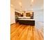 Contemporary kitchen featuring a center island, stainless steel appliances, and hardwood floors at 1950 Menet St, Apex, NC 27502