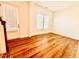 Bright living room features hardwood floors, and neutral paint colors at 1950 Menet St, Apex, NC 27502