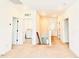Upstairs hallway with natural light, multiple rooms, and neutral carpet at 1950 Menet St, Apex, NC 27502