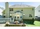 Exterior view of home with patio, seating, fire pit, and nice backyard at 212 Mickleson Ridge Dr, Raleigh, NC 27603