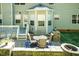 Exterior shot of home with a patio and outdoor seating with green space at 212 Mickleson Ridge Dr, Raleigh, NC 27603