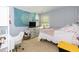 Bright bedroom with decorative wall hanging, neutral colors, and ample natural light at 212 Mickleson Ridge Dr, Raleigh, NC 27603