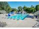 Community pool with a slide, lounge chairs, and well-maintained surroundings providing a relaxing recreational space at 212 Mickleson Ridge Dr, Raleigh, NC 27603