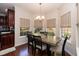 Bright dining room with a table that seats six, surrounded by windows providing natural light at 212 Mickleson Ridge Dr, Raleigh, NC 27603