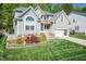 Lovely two-story house with an attached garage and beautifully landscaped front yard at 212 Mickleson Ridge Dr, Raleigh, NC 27603