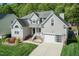 Beautiful two-story home featuring manicured lawn and a two-car attached garage at 212 Mickleson Ridge Dr, Raleigh, NC 27603
