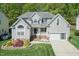 Inviting two-story home with manicured lawn and a convenient two-car garage at 212 Mickleson Ridge Dr, Raleigh, NC 27603