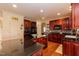 Spacious kitchen features dark cabinetry, granite countertops, and stainless-steel appliances at 212 Mickleson Ridge Dr, Raleigh, NC 27603