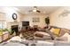 Inviting living room with a fireplace, a ceiling fan, and comfortable seating at 212 Mickleson Ridge Dr, Raleigh, NC 27603