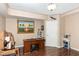 Finished basement featuring wood flooring, desk, and unique artwork, offering a versatile space for work or hobbies at 2317 Rainy Lake St, Wake Forest, NC 27587