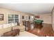 Open basement area includes a comfortable sectional sofa, game table, and pool table for entertainment at 2317 Rainy Lake St, Wake Forest, NC 27587