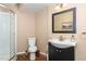 Well-lit bathroom features a walk-in shower and a modern vanity with a sleek design and stylish fixtures at 2317 Rainy Lake St, Wake Forest, NC 27587