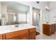 Bathroom featuring double sinks, a large mirror, and a view of the tub and shower at 2317 Rainy Lake St, Wake Forest, NC 27587