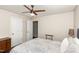 Bedroom featuring hardwood floors, a ceiling fan, and ample closet space at 2317 Rainy Lake St, Wake Forest, NC 27587