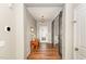 Inviting foyer featuring hardwood floors, a console table, and a decorative front door at 2317 Rainy Lake St, Wake Forest, NC 27587