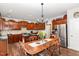 Open kitchen and dining area with granite countertops, a dining table, and stainless steel appliances at 2317 Rainy Lake St, Wake Forest, NC 27587