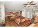 Open-concept living space with a kitchen, dining area, and comfortable living room featuring a ceiling fan at 2317 Rainy Lake St, Wake Forest, NC 27587