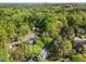 Aerial perspective of residential neighborhood showcasing a two-story house surrounded by lush trees at 2520 Ashley Ct, Raleigh, NC 27607