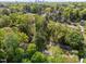 Suburban landscape featuring tree-lined streets and a two-story home with a gray roof at 2520 Ashley Ct, Raleigh, NC 27607
