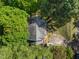 Overhead shot capturing the roofline and driveway of the two-story home surrounded by mature trees at 2520 Ashley Ct, Raleigh, NC 27607