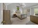 Bright bedroom boasts vaulted ceilings, a ceiling fan, skylight, and a tapestry above the bed at 2520 Ashley Ct, Raleigh, NC 27607