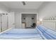 Comfortable bedroom featuring blue and white bedding and ensuite storage, perfect for relaxation at 2520 Ashley Ct, Raleigh, NC 27607
