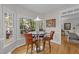 Cozy breakfast nook with large windows overlooking a landscaped yard and a round table with seating at 2520 Ashley Ct, Raleigh, NC 27607
