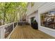 Exterior deck with seating, a grill, and views of surrounding trees at 2520 Ashley Ct, Raleigh, NC 27607
