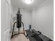 A simple exercise room with a punching bag and weight bench, offering a dedicated workout space at 2520 Ashley Ct, Raleigh, NC 27607