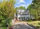 Desirable two-story house with black shutters, dormers, landscaped yard, and concrete driveway at 2520 Ashley Ct, Raleigh, NC 27607