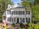 Charming two-story home with black shutters, dormers, and beautifully landscaped front yard at 2520 Ashley Ct, Raleigh, NC 27607
