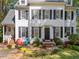 Traditional two-story home with black shutters, dormers, manicured lawn, and stone walkway at 2520 Ashley Ct, Raleigh, NC 27607