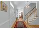 Welcoming foyer featuring wood floors, staircase, and an ornate chandelier at 2520 Ashley Ct, Raleigh, NC 27607