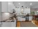 Gourmet kitchen with white cabinets, stainless steel appliances, and hardwood floors at 2520 Ashley Ct, Raleigh, NC 27607