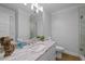 Elegant bathroom with marble countertop, framed mirror, and walk-in glass shower, providing a spa-like retreat at 255 Seven Island Rd, Pittsboro, NC 27312