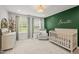 Bright Bedroom with custom decor, soft chair, and natural light from two windows at 255 Seven Island Rd, Pittsboro, NC 27312