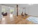 Open-concept space featuring hardwood floors, natural light, and seamless flow between living and dining areas at 255 Seven Island Rd, Pittsboro, NC 27312