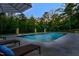 Stunning pool area with fountain features, lush greenery, and comfortable lounge chairs for ultimate relaxation at 255 Seven Island Rd, Pittsboro, NC 27312