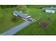 Aerial view of a home with a garden, cars in the driveway, and a green roof at 2960 Epps Clark Rd, Siler City, NC 27344