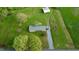 Aerial view of a home with a long driveway, outbuilding, and well-maintained greenery at 2960 Epps Clark Rd, Siler City, NC 27344