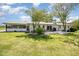 Spacious backyard with a charming home, deck, and lush lawn at 2960 Epps Clark Rd, Siler City, NC 27344