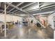 Unfinished basement with exposed ceiling, stairs, and ample storage space at 2960 Epps Clark Rd, Siler City, NC 27344