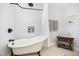 Elegant bathroom with clawfoot tub and patterned tile flooring at 2960 Epps Clark Rd, Siler City, NC 27344