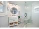 Charming bathroom featuring a farmhouse sink, patterned tile floors, a glass-enclosed shower, and modern fixtures at 2960 Epps Clark Rd, Siler City, NC 27344