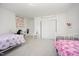 Spacious bedroom with twin beds, white walls, and a walk-in closet, providing a versatile and inviting space at 2960 Epps Clark Rd, Siler City, NC 27344