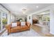 Bright and airy living space featuring wood-look floors, comfortable seating and access to the dining room at 2960 Epps Clark Rd, Siler City, NC 27344