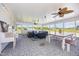 Inviting sunroom with ceiling fans, stylish furniture, and backyard view at 2960 Epps Clark Rd, Siler City, NC 27344